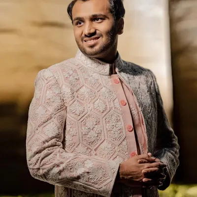 For his Godh ceremony, we styled Labhya in an elegant pink and white Manish Malhotra sherwani. The intricate thread work and soft color palette created a look of refined sophistication.