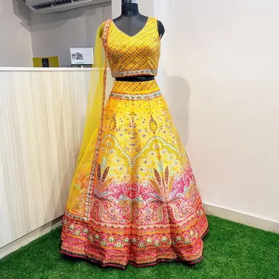 A full view of my popular Haldi lehenga, showcasing the contrast between the sequined yellow blouse and the colorful printed skirt. It's a complete, ready-to-wear look for any pre-wedding celebration.