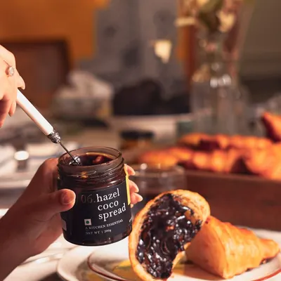 Our Hazel Coco Spread is perfect for upgrading your breakfast. Here it is being generously spread on a warm croissant, making for a decadent and delicious start to the day.