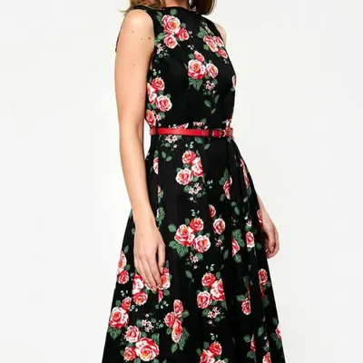 Our black floral A-line dress is a timeless choice for daytime events, brunches, or semi-formal parties. The classic cut is flattering on many body types, and the rose print adds a touch of romantic charm.