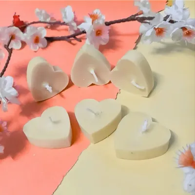 A simple arrangement of my cream-colored, heart-shaped soy wax tealights. These are unscented, perfect for those who prefer a simple, clean burn.