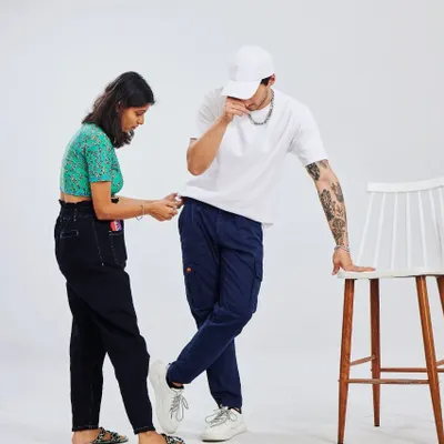 Here's a candid moment from a shoot with Snitch. As a stylist, I'm always making sure every detail is perfect, from the fit of the pants to the overall posture of the model. It's this hands-on approach that brings a look to life.