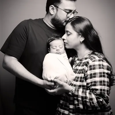 A timeless black and white family portrait with a newborn. My studio sessions are designed to be peaceful and safe, allowing us to capture the profound love of a new family.