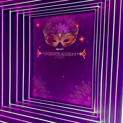 Here’s a closer look at the custom-branded video booth backdrop for the Google Masquerade Party. The neon-lit tunnel created an immersive experience, clearly displaying the event's theme and branding for every slow-motion video captured.