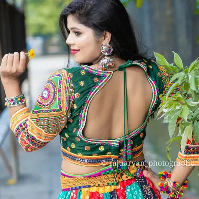 Dandiya and Garba season is here. My handmade chaniya cholis have a full gher (flare) perfect for twirling. This multi-colored outfit with a backless blouse design is available to rent or buy.