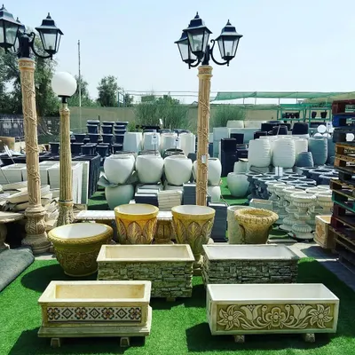 A selection of the high-quality planters, pots, and garden lighting we offer. We have a wide range of materials, from ornate stone planters to modern ceramic pots and classic lampposts, to suit any garden style.