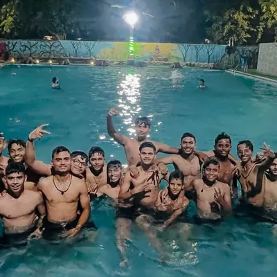 The team enjoying some well deserved downtime in the swimming pool during our Punjab tour. It's important to have fun and bond as a team.