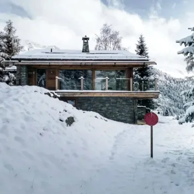 Our Swiss chalet project transformed by a blanket of snow. Designing for different seasons is key, and here the structure provides a warm, cozy refuge while still offering expansive views of the dramatic winter landscape.