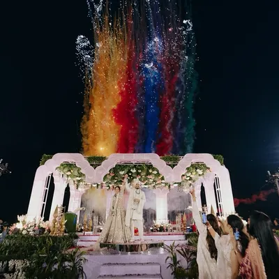 A spectacular varmala moment with a rainbow of colors. We use creative effects like colored smoke to make your ceremony visually stunning and unique.