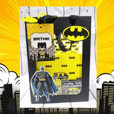 This custom Batman-themed gift bag is perfect for a superhero party. It features a personalized tag and the iconic Bat-Signal, ready to be filled with goodies.