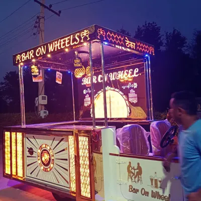 A side view of our 'Bar on Wheels' as it's being set up for an event. This mobile bar is a self-contained unit, allowing us to bring a complete, professional bar service to any location, no matter how remote.