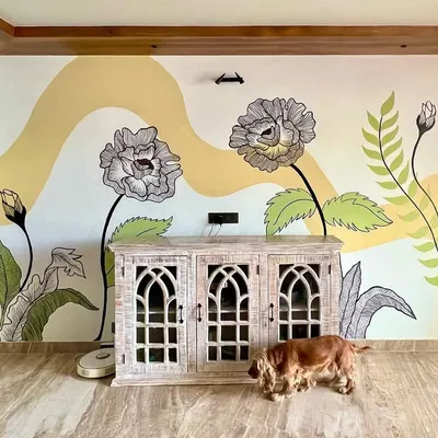 A full view of a 12x8 foot floral mural created for a client's home. The design combines delicate line work with soft color blocking to create a serene and artistic atmosphere.