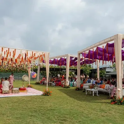 For the bride who dreamt of a purple Haldi, we brought her vision to life. This outdoor setup combines vibrant purple drapes with traditional orange marigolds, creating a unique and festive atmosphere for the ceremony.