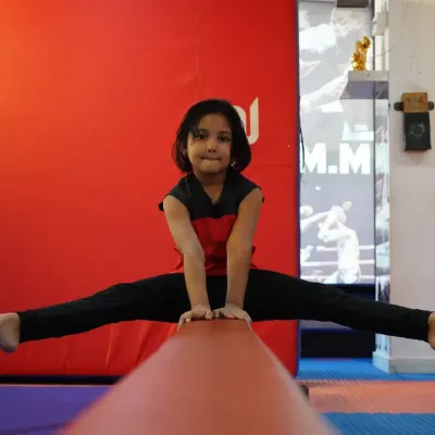 Balance, focus, and confidence on full display. Our gymnastics program helps children develop exceptional strength and flexibility, and this young athlete demonstrates the amazing results of her dedication on the balance beam.