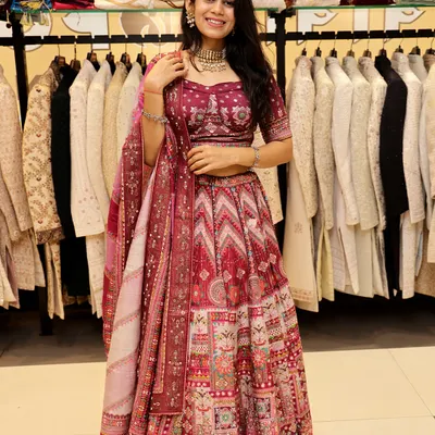 This maroon lehenga is a fantastic choice for a wedding or sangeet. The rich color and intricate, multi-patterned design create a look that is both traditional and eye-catching.