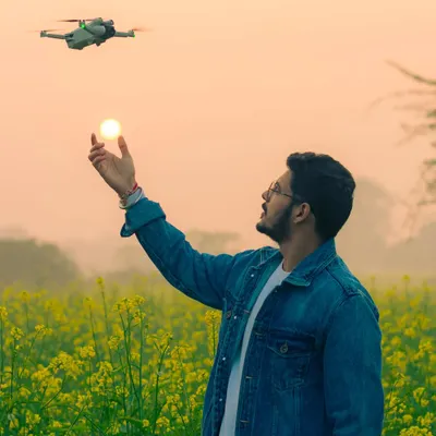 A creative shot featuring my DJI Mini 3 Pro drone at sunset. This image not only shows the gear I use for aerial photography but also reflects my playful and artistic approach to content creation.