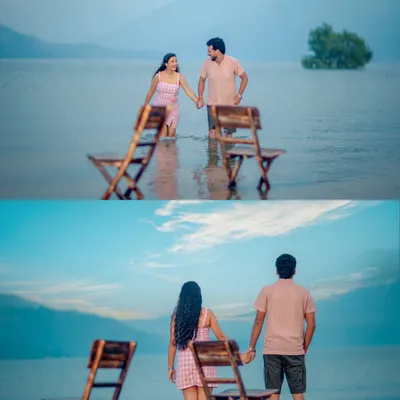 A unique and creative shot of a couple standing in the shallow waters of Tehri Lake with chairs, creating a surreal and romantic pre-wedding photograph.