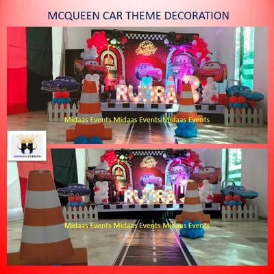 "Kachow!" This Lightning McQueen car theme for Rudra's 3rd birthday was all about speed. The main backdrop looks like a pit stop, complete with a road-printed floor, traffic cones, and the birthday boy's name in lights.