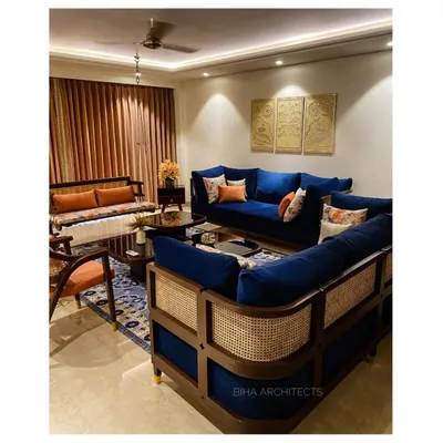In this recently completed Gurgaon home, we used a rich royal blue velvet sofa with a cane-work frame as the centerpiece. This piece of bespoke furniture combines traditional craftsmanship with a modern silhouette, setting the tone for a space that is both elegant and unique.