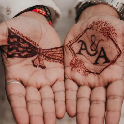 This geometric frame with the couple's initials is a perfect example of a modern groom mehendi design. It's bold, clean, and makes a statement while still feeling very personal and sophisticated.