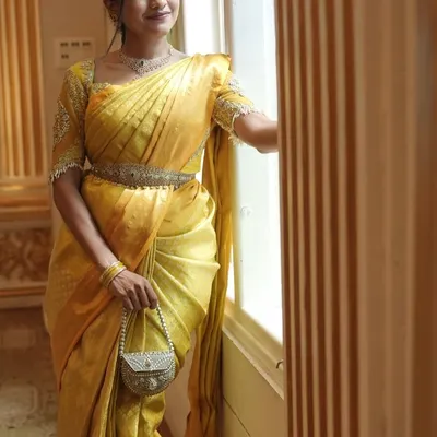 Dressed in a traditional yellow silk saree for a beautiful wedding ceremony. I love embracing traditional hues and elegant styles for daytime events.