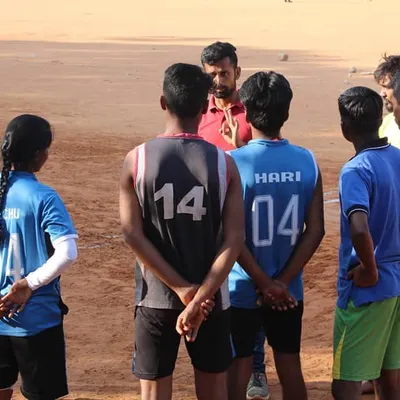 Training is more than just drills; it's about strategy and communication. Here, we're in a huddle discussing tactics for Kho-Kho. We believe in building smart players who work together as one team, one family.