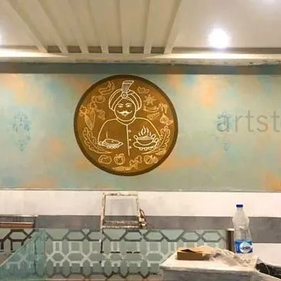 We hand-painted this custom logo for a restaurant directly onto the textured wall. This is a great way for businesses to incorporate their branding into their interior design in a unique and artistic way.