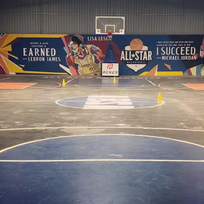This is our home. A full view of the Crossover Court, featuring our regulation markings and the iconic mural that inspires every player who steps on the floor.