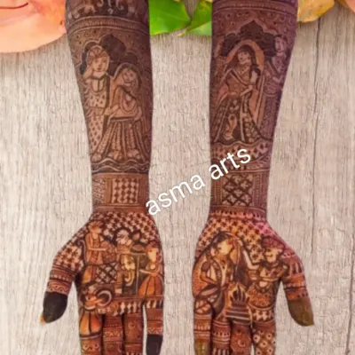 For this bride, I created a full narrative on her arms, with portraits of the couple, scenes from a traditional Indian wedding ceremony, and decorative elephants. This is my favorite way to make bridal henna truly personal and unforgettable.