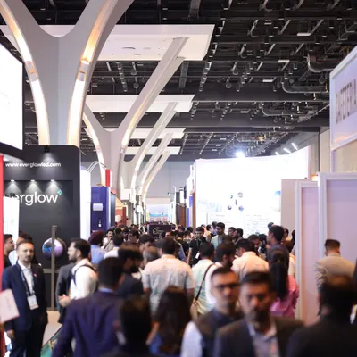 The expansive halls of the Jio World Convention Centre filled with attendees, showcasing the immense scale and draw of India's largest smart home technology event.