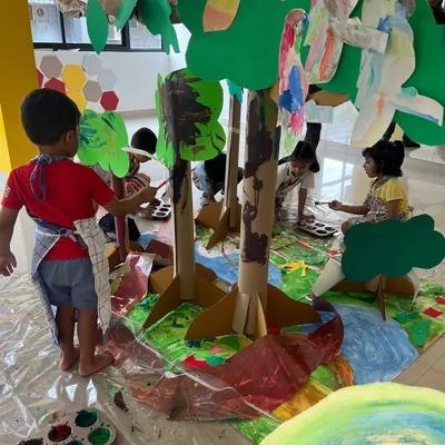A glimpse into our "Art & Artists Around the World" camp, where we built an entire cardboard jungle. Children work together to paint trees, create animals, and construct a vibrant ecosystem, learning about collaboration and large-scale art.