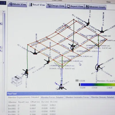Every project begins with rigorous engineering. This screen shows a structural stress analysis for a steel frame, where we calculate loads and forces to ensure every structure we build is safe, stable, and built to last.