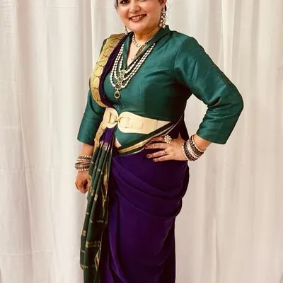 It brings me so much joy to see my clients shine. This beautiful client is wearing a custom-fitted Nauvari-style draped saree, complete with a matching belt and a perfectly coordinated silk blouse, showcasing a complete, personalized ethnic look.
