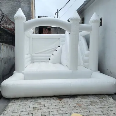 Another view of our all-white wedding bouncy castle. The clean lines and absence of color make it a sophisticated addition to any formal event.