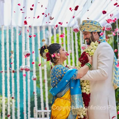 The Varmala (garland exchange) is one of the most photogenic moments of a wedding. I captured this shot as petals rained down, framing the couple in a shower of color and joy.