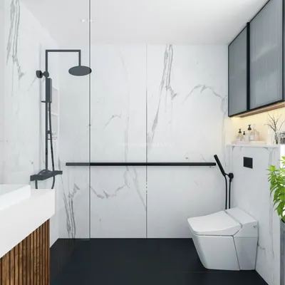 A modern bathroom at Svamitva Terravana, featuring white marble-patterned walls, black flooring, and sleek black fixtures for a high-contrast, luxurious feel.