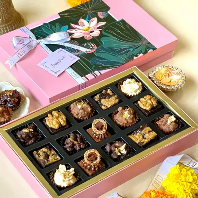 My Diwali collection is all about luxury and light. This premium pink box holds an assortment of 16 of my signature mini brownies, each with a unique topping, making it a perfect gift for sharing with family and friends.
