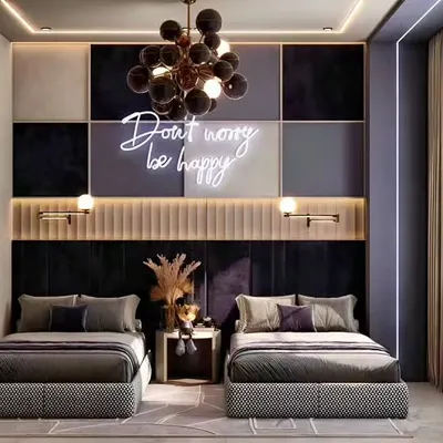 We designed this shared bedroom with a touch of glamour, featuring a "Don't worry be happy" neon sign as a focal point. The dark, paneled accent wall and dramatic chandelier create a moody yet uplifting atmosphere.