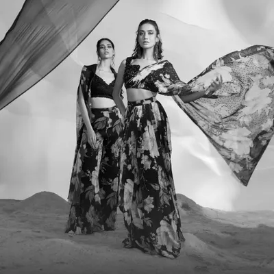 A black and white composition featuring two of my floral printed ensembles. I use monochrome photography to focus on the silhouette, movement, and interplay of patterns in my designs.