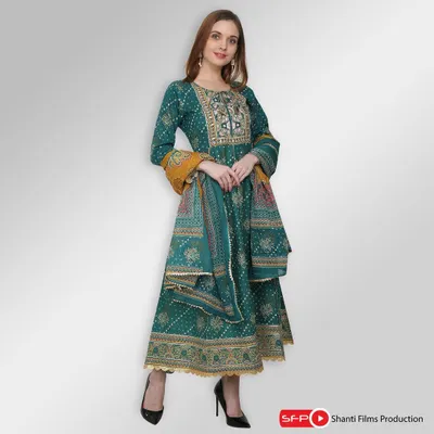 A full-length shot of a model in a teal Anarkali suit, showcasing the garment's flow, intricate embroidery, and coordinated dupatta. This type of image is perfect for giving customers a complete view of an ethnic outfit.