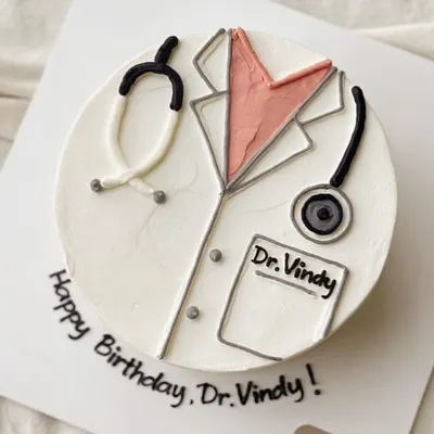 A personalized cake is a fantastic way to celebrate a major career milestone, like becoming a doctor. This design features a neatly frosted doctor's coat and stethoscope, with the name and occasion written right on the board. It’s a thoughtful and delicious gift for the graduate in your life.