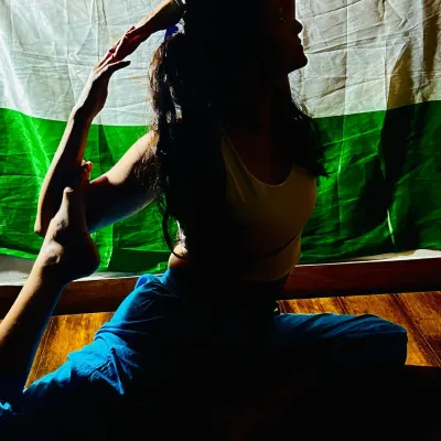 Celebrating Independence Day with a yoga pose that embodies strength and grace. A silhouette of Eka Pada Rajakapotasana against our flag.