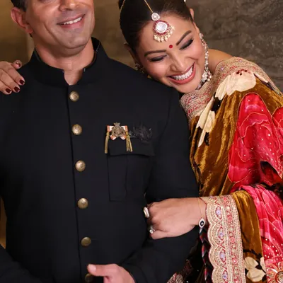 A joyful, candid photograph of Bipasha Basu and Karan Singh Grover. My goal at private events is to become a seamless part of the celebration, capturing genuine moments as they unfold.