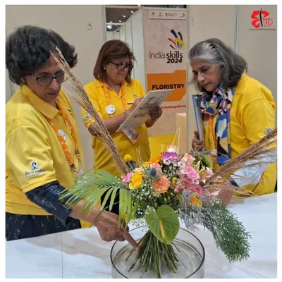 Our expert instructors carefully examining a competitor's hand-tied bouquet at the IndiaSkills 2024 national competition. As official partners, we play a crucial role in judging and mentoring the nation's most promising young floral talent.