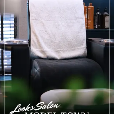 Your seat is waiting. This image shows one of our plush, comfortable pedicure chairs, ready for your next relaxation session in our clean and professional salon environment.