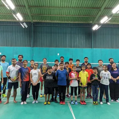A group photo from one of our monthly badminton match days. It's all about healthy competition and having a great time on the court.