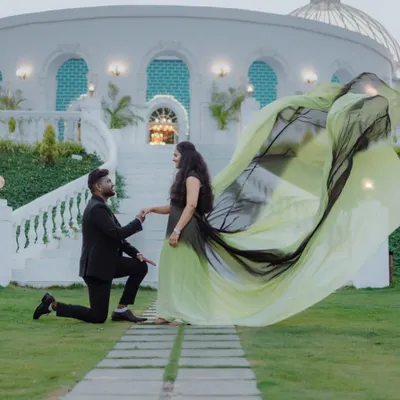A proposal moment made even more magical. The ombre trail of this gown creates a beautiful frame for the couple, adding a sense of grandeur to this pre-wedding memory.