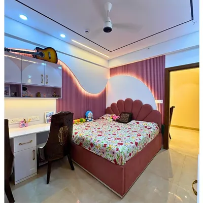 A dream room for a little rockstar. This space features a fun, wavy pink and white accent wall, a shell-shaped headboard, and a guitar displayed proudly on the shelf.