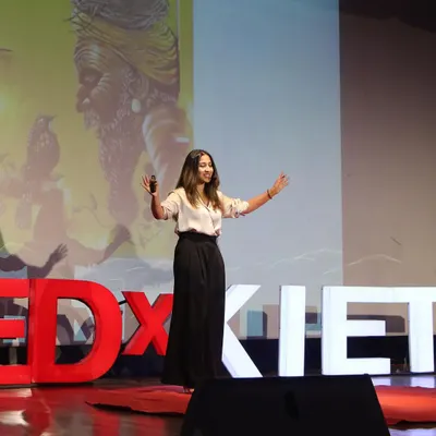 On stage for my TEDx talk, sharing my four-phase creative process: inhalation, assimilation, digestion, and exhalation. It was an honor to share the philosophy behind my art and my 'Travel and Paint' tour.