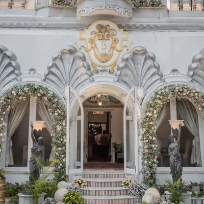 When the decor at the entrance is this stunning, you know the celebration inside is next level. I designed this grand floral entrance to welcome guests to the Birla wedding with elegance and opulence.